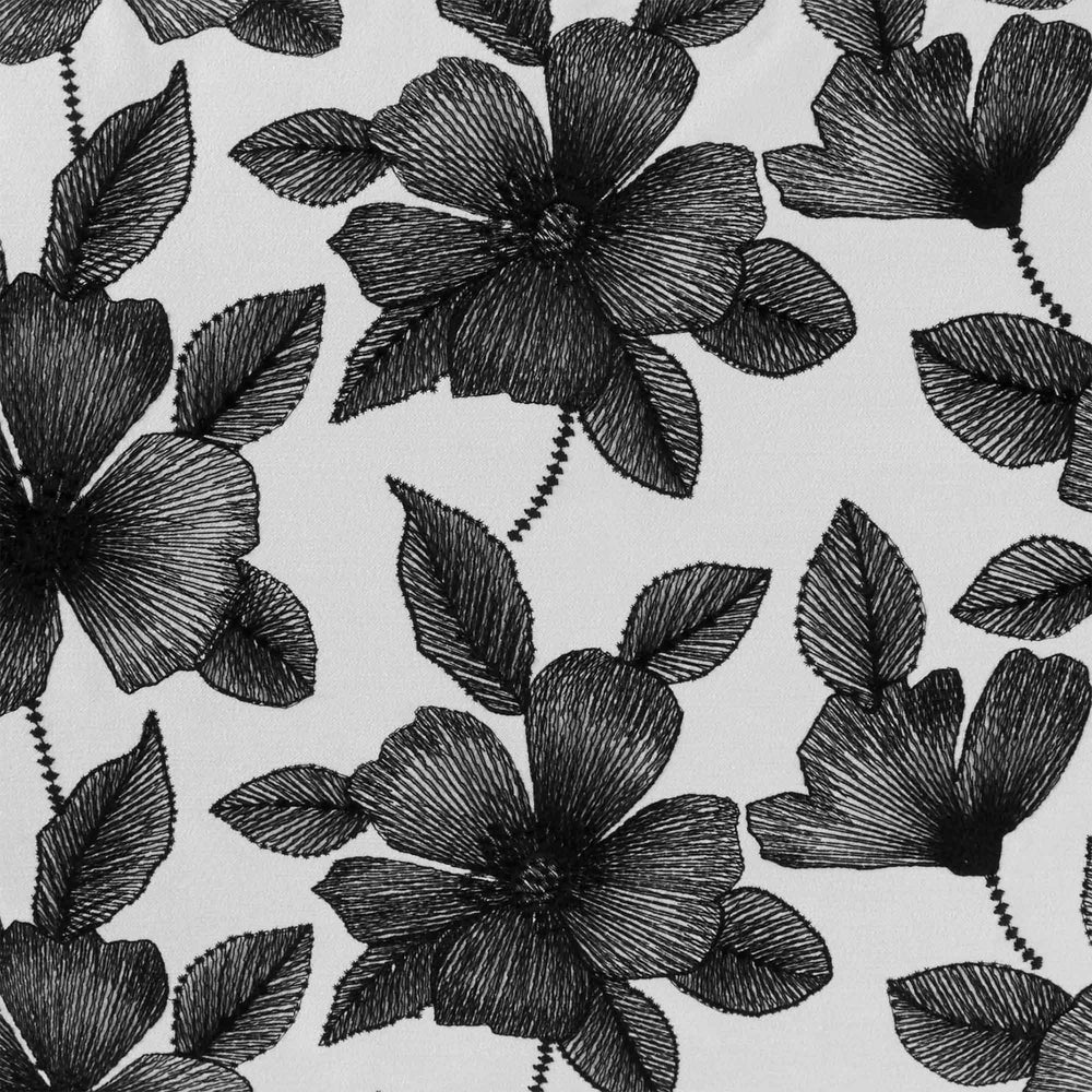 Housse de coussin brodée ORNELLA blanc et noir - 55x110 cm - Motif hibiscus sophistiqué - 5